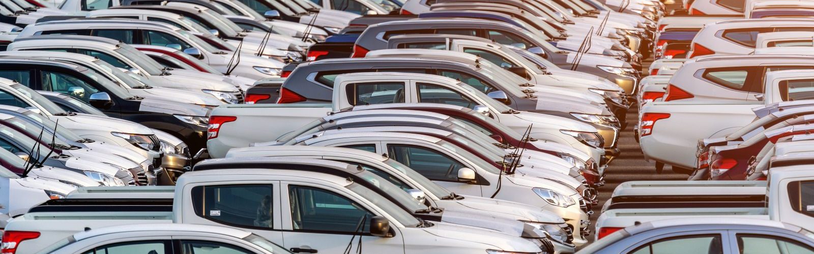 Row of new cars in port. Row of new cars in port.